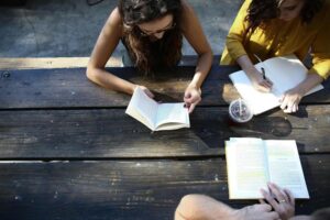 a few people studying at a table